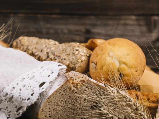 ear-wheat-with-baked-bread-wooden-table